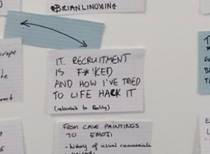 Index card on a wall, surrounded by others, it reads IT recruitment is f@!ked and how I tried to life hack it